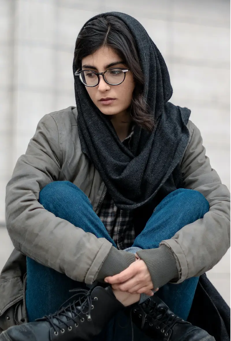 woman with hijab looking sad
