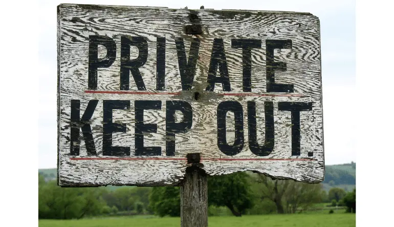 sign that reads private keep out